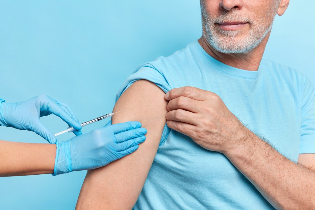 faceless-doctor-makes-covid-19-vaccine-injection-elderly-patient-wears-protective-rubber-gloves_273609-52652.jpg